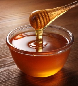 Honey dripping off a spoon
